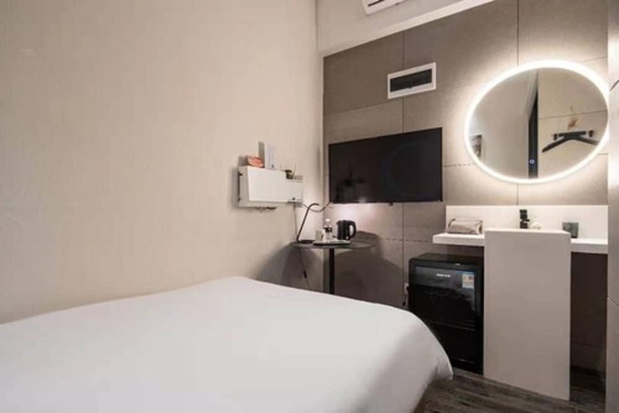 Imagen de la habitación del Hotel Moju Shanghai. Foto 2