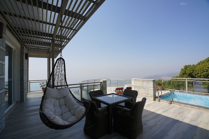 Imagen de la habitación del Hotel Moksha Himalaya Spa Resort. Foto 15