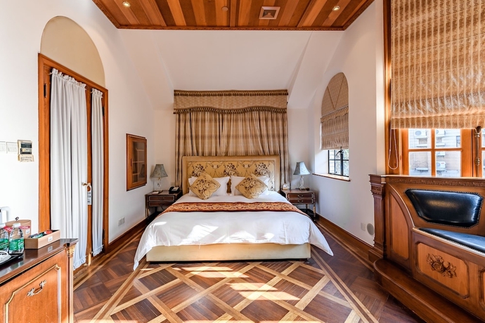 Imagen de la habitación del Hotel Moller Villa Shanghai. Foto 16