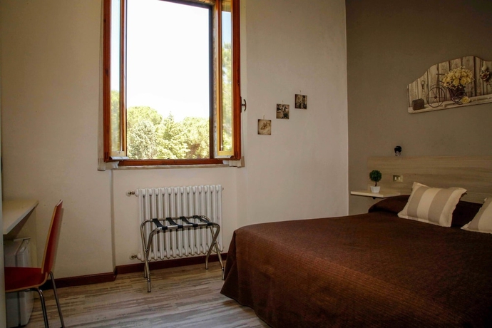 Imagen de la habitación del Hotel Mom Assisi, Santa Maria Degli Angeli. Foto 5