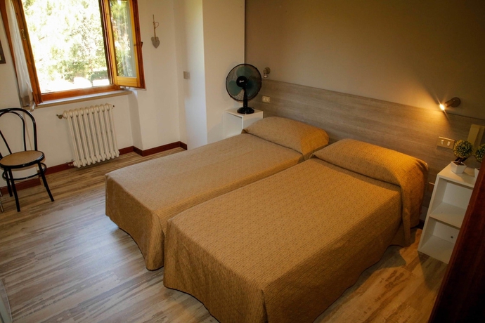 Imagen de la habitación del Hotel Mom Assisi, Santa Maria Degli Angeli. Foto 6