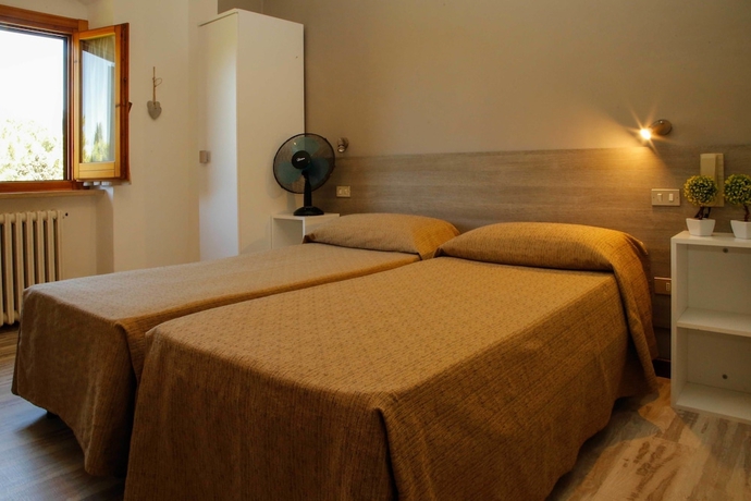 Imagen de la habitación del Hotel Mom Assisi, Santa Maria Degli Angeli. Foto 7