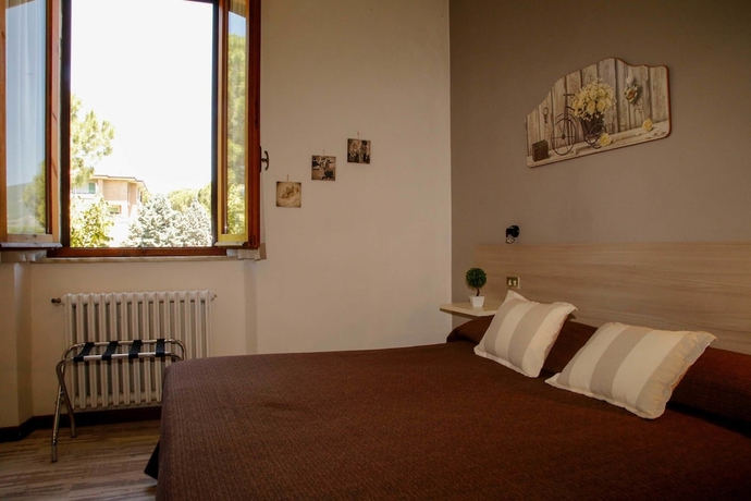 Imagen de la habitación del Hotel Mom Assisi, Santa Maria Degli Angeli. Foto 9