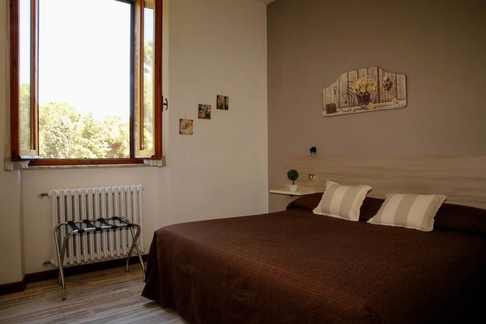 Imagen de la habitación del Hotel Mom Assisi, Santa Maria Degli Angeli. Foto 13