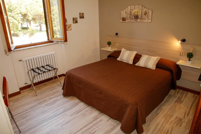 Imagen de la habitación del Hotel Mom Assisi, Santa Maria Degli Angeli. Foto 14