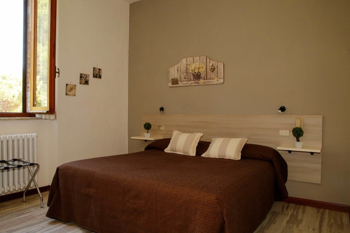 Imagen de la habitación del Hotel Mom Assisi, Santa Maria Degli Angeli. Foto 17
