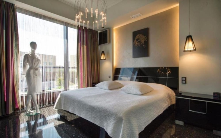 Imagen de la habitación del Hotel Mona Boutique. Foto 10