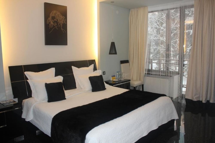 Imagen de la habitación del Hotel Mona Boutique. Foto 13