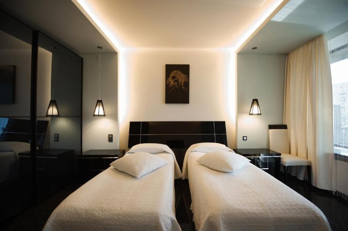 Imagen de la habitación del Hotel Mona Boutique. Foto 14