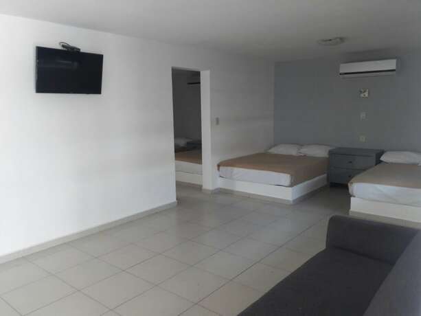 Imagen de la habitación del Hotel Mona Inn. Foto 22