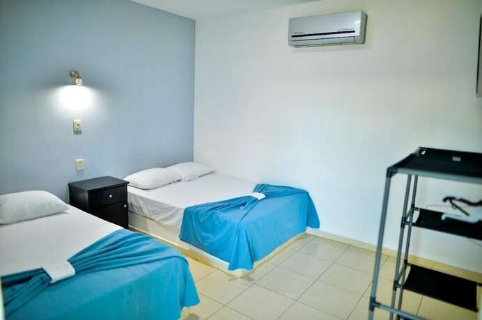 Imagen de la habitación del Hotel Mona Inn. Foto 25