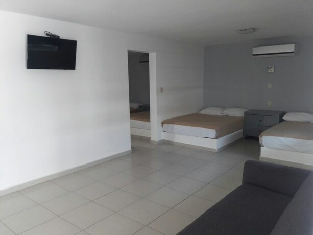 Imagen de la habitación del Hotel Mona Inn. Foto 26