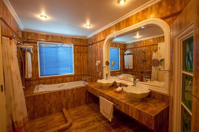 Imagen de la habitación del Hotel Monaco Suites De Boracay. Foto 3