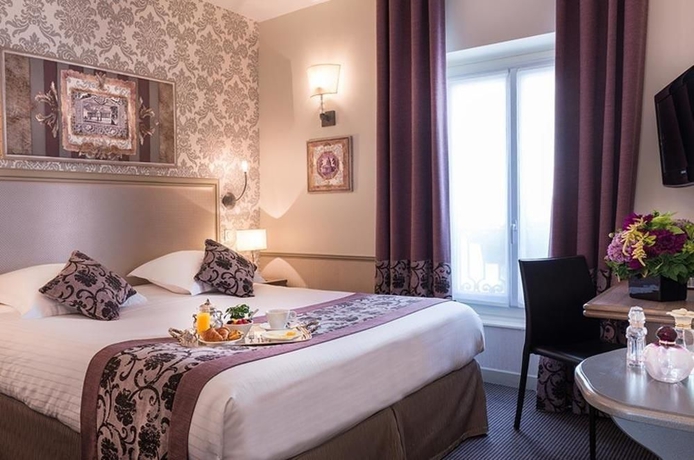 Imagen de la habitación del Hotel Monceau Wagram. Foto 15