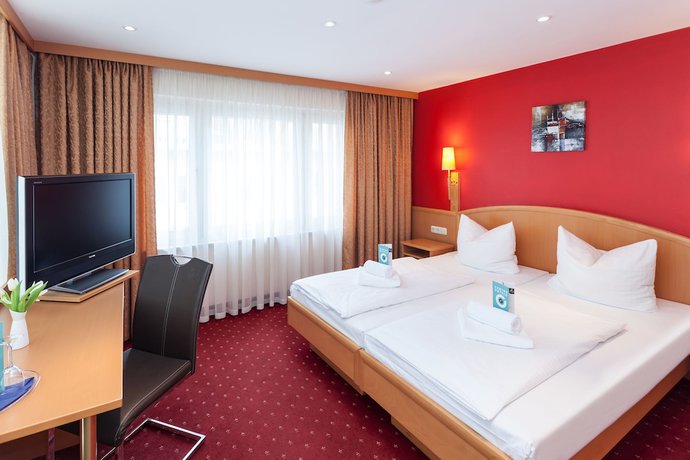 Imagen de la habitación del Hotel Mondial Munich. Foto 11