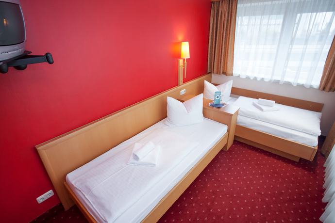 Imagen de la habitación del Hotel Mondial Munich. Foto 13