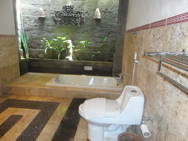 Imagen de la habitación del Hotel Monkey Forest Bungalow. Foto 19