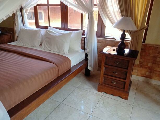 Imagen de la habitación del Hotel Monkey Forest Bungalow. Foto 20