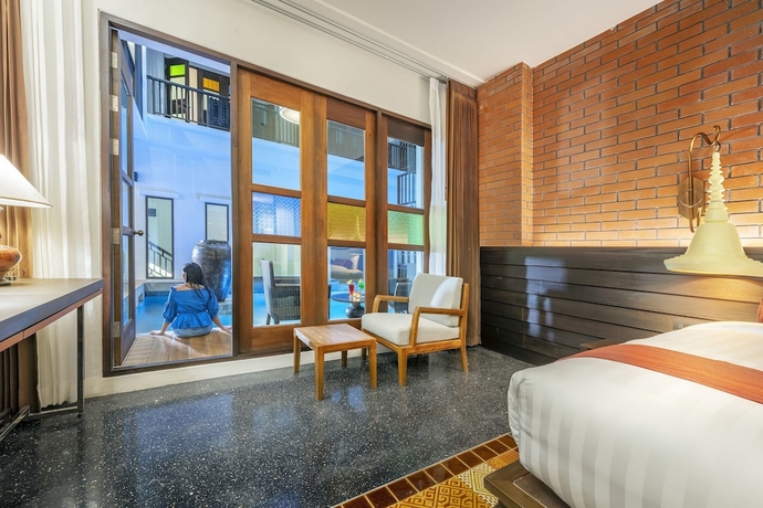 Imagen de la habitación del Hotel Monkham Village Hatyai. Foto 17