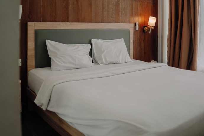 Imagen de la habitación del Hotel Monopoli Inn Bukittinggi. Foto 7