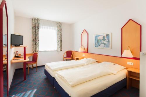 Imagen de la habitación del Hotel Montana Lauenau. Foto 18