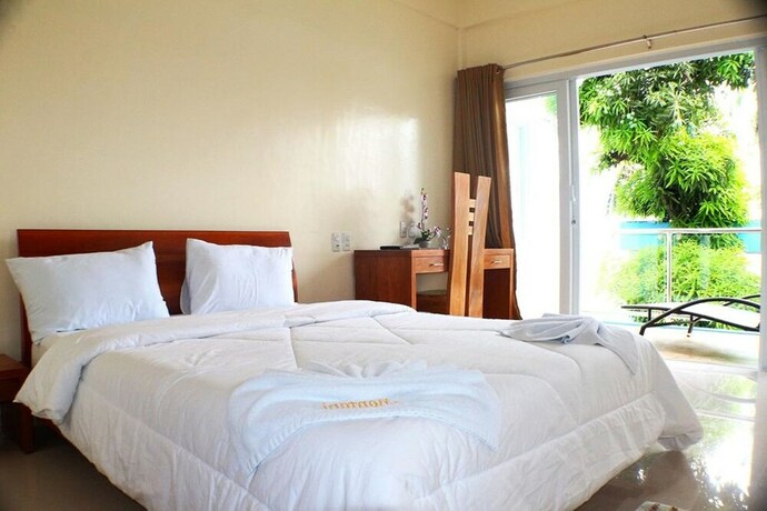 Imagen de la habitación del Hotel Montani Beach Resort. Foto 15