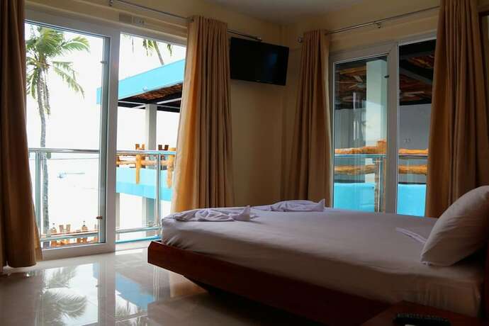 Imagen de la habitación del Hotel Montani Beach Resort. Foto 35