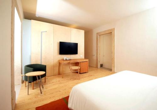 Imagen de la habitación del Hotel Montebelo Mosteiro De Alcobaça Historic. Foto 14