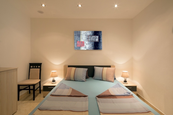 Imagen de la habitación del Hotel Montelux Apartments. Foto 13