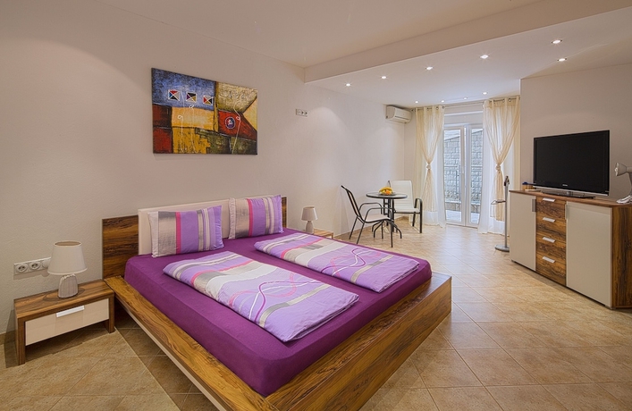 Imagen de la habitación del Hotel Montelux Apartments. Foto 14