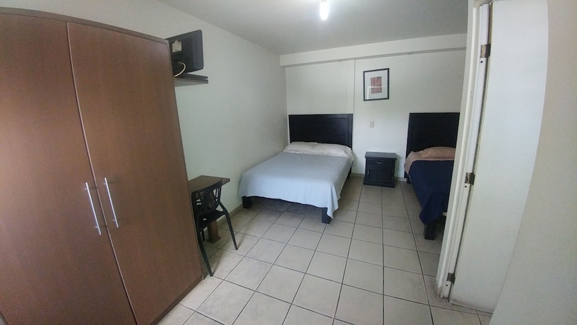 Imagen de la habitación del Hotel Montemorelos Suites. Foto 4