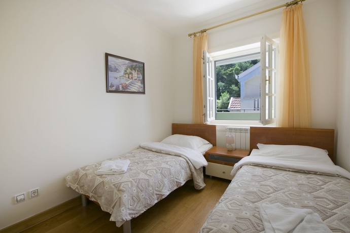Imagen de la habitación del Hotel Montesan Apartments. Foto 16