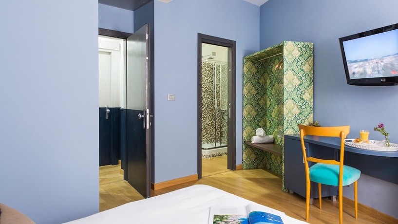 Imagen de la habitación del Hotel Monti First. Foto 13