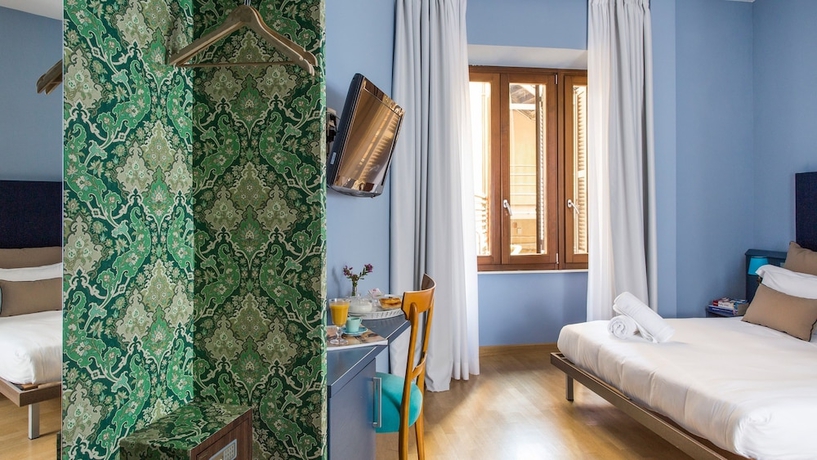 Imagen de la habitación del Hotel Monti First. Foto 14