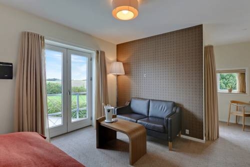 Imagen de la habitación del Hotel Montra Sabro Kro. Foto 2