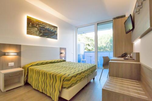 Imagen de la habitación del Hotel Montreal, Lido dei Pini. Foto 18