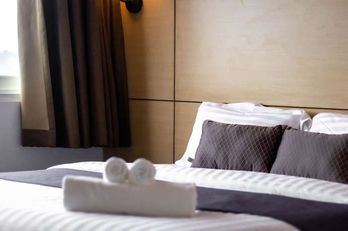 Imagen de la habitación del Hotel Montree Phuket. Foto 3