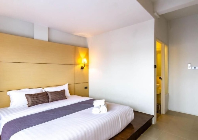 Imagen de la habitación del Hotel Montree Phuket. Foto 4
