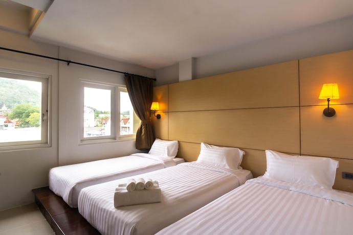 Imagen de la habitación del Hotel Montree Phuket. Foto 5