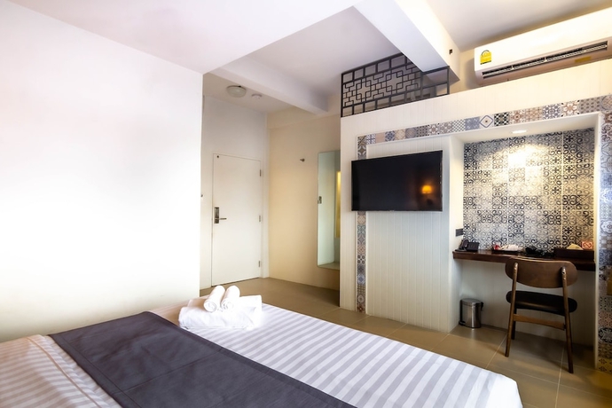 Imagen de la habitación del Hotel Montree Phuket. Foto 7