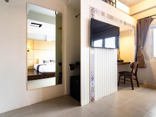Imagen de la habitación del Hotel Montree Phuket. Foto 8