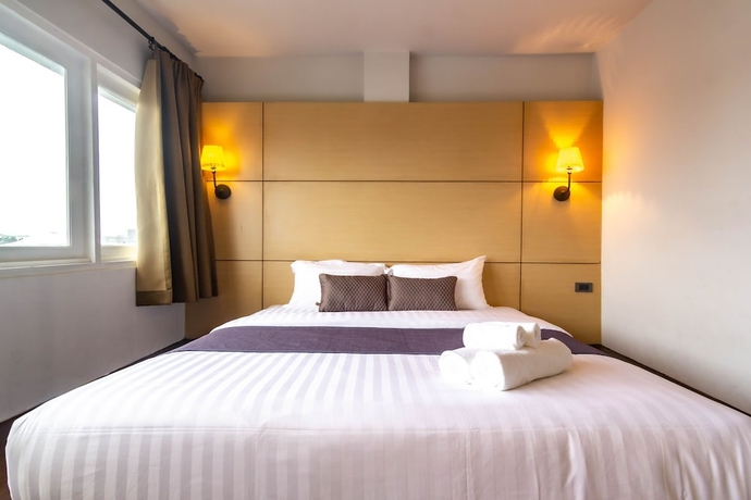 Imagen de la habitación del Hotel Montree Phuket. Foto 11