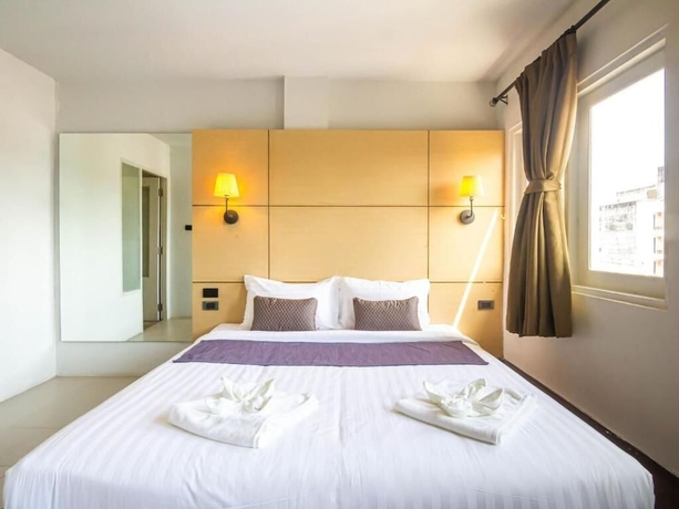 Imagen de la habitación del Hotel Montree Phuket. Foto 12