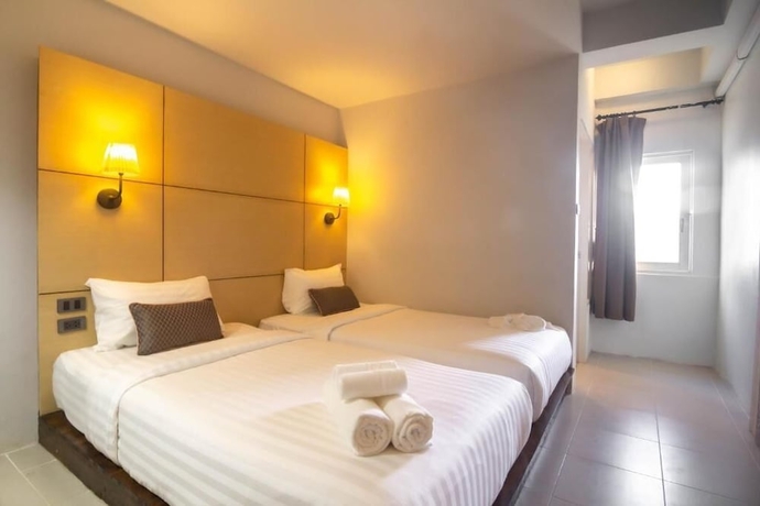 Imagen de la habitación del Hotel Montree Phuket. Foto 13