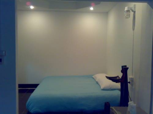 Imagen de la habitación del Hotel Moon House At Clock Tower. Foto 16