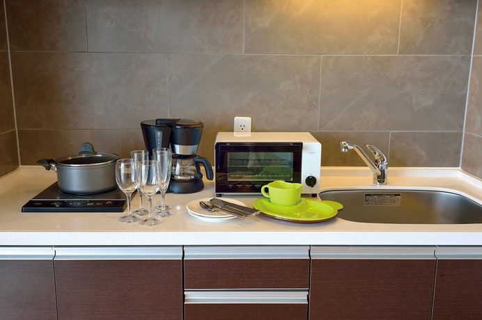 Imagen de la habitación del Hotel Moon Ocean Ginowan and Residence. Foto 8