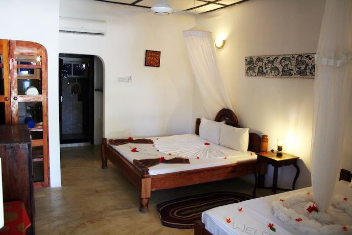 Imagen de la habitación del Hotel Moonshine Uroa Boutique. Foto 20