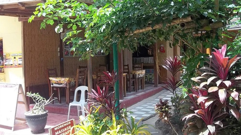Imagen del bar/restaurante del Hotel Moreno's Cottages. Foto 3