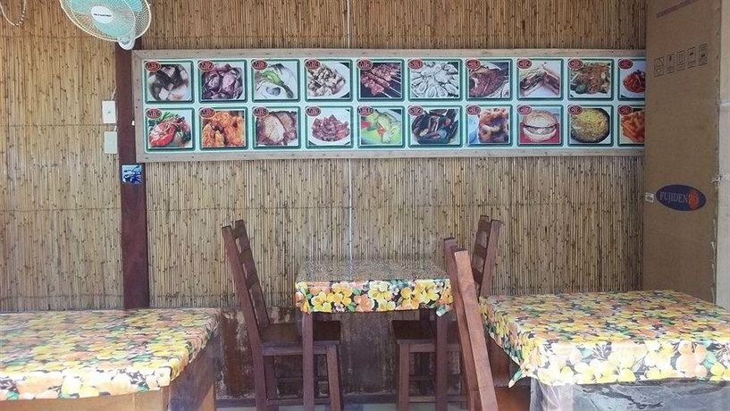 Imagen del bar/restaurante del Hotel Moreno's Cottages. Foto 4