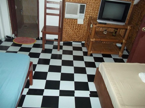 Imagen de la habitación del Hotel Moreno's Cottages. Foto 10